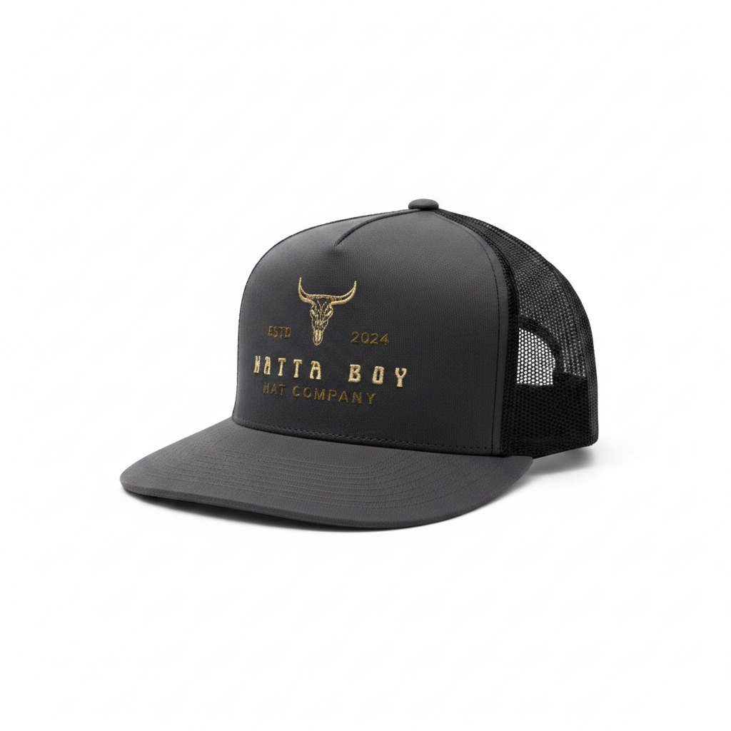 Charcoal and black trucker hat with gold embroidered Hatta Boy bull skull logo