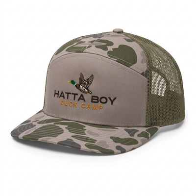 DUCK CAMP camouflage hat, angled view on white background